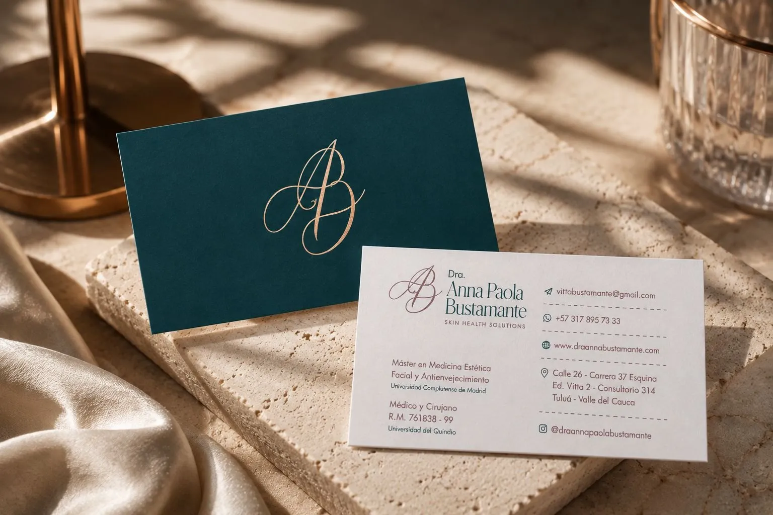 Business cards with a gold monogram